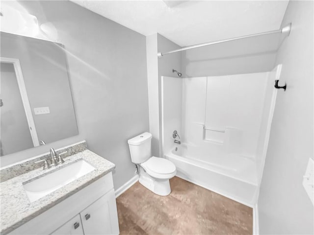 bathroom with toilet, bathtub / shower combination, vanity, and baseboards