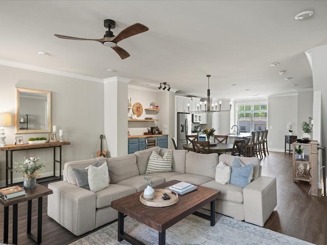 3862 Firewood Ln Unit 110, Suwanee, GA 30024 - living room with a chandelier, crown molding, beverage cooler, dark wood-style flooring, and ceiling fan