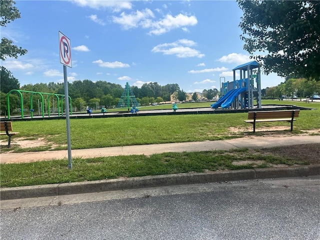 view of community with a yard and a playground