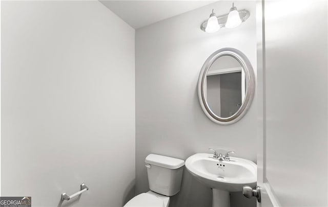 bathroom with sink and toilet