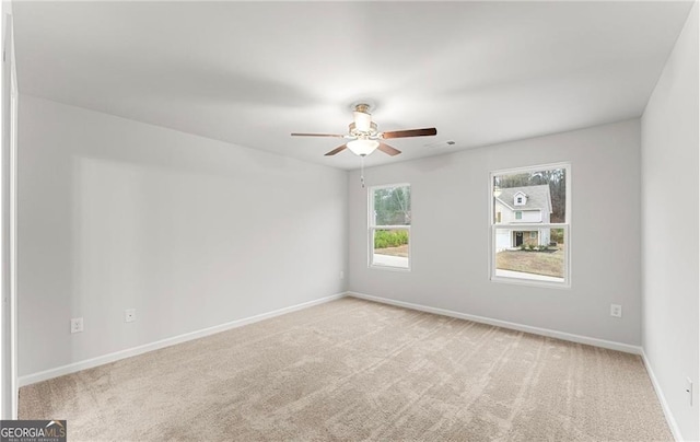 carpeted empty room with ceiling fan