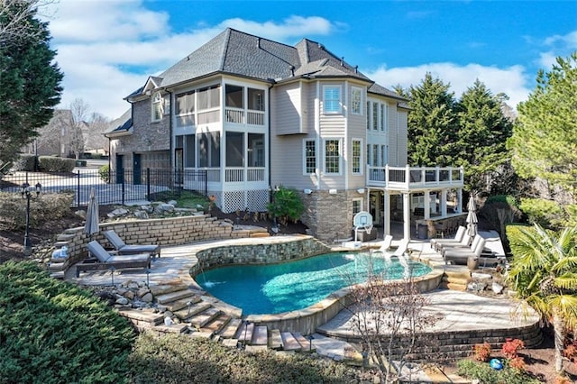 back of house with a patio and a sunroom