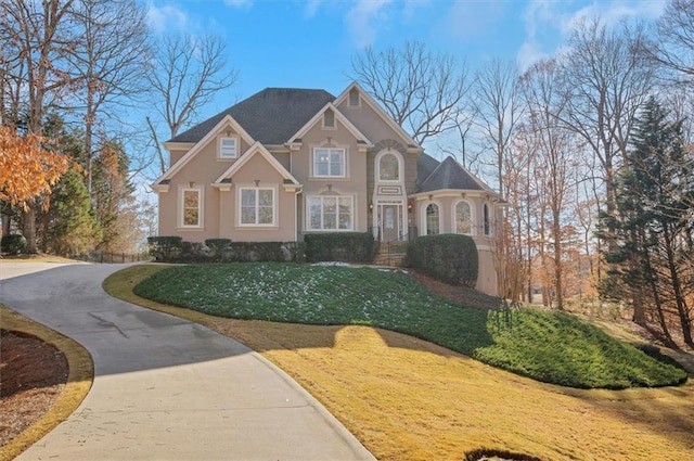 view of front of property with a front lawn