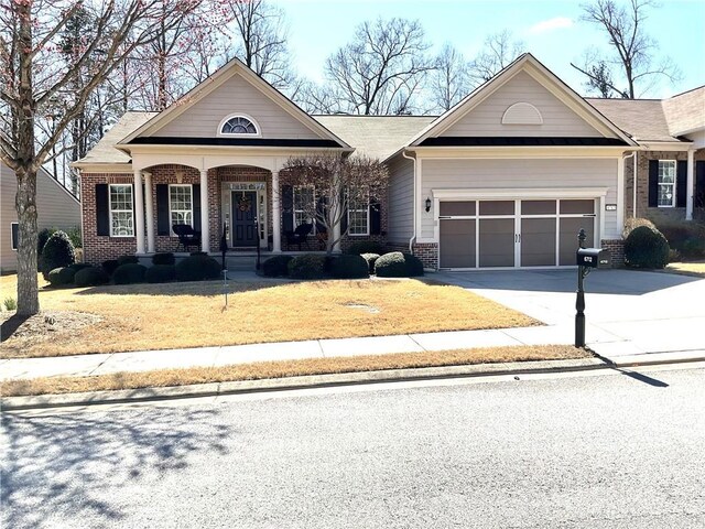 view of front of home with a garage and covered porch