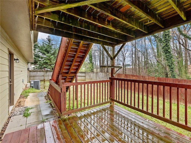 deck with a fenced backyard and central AC