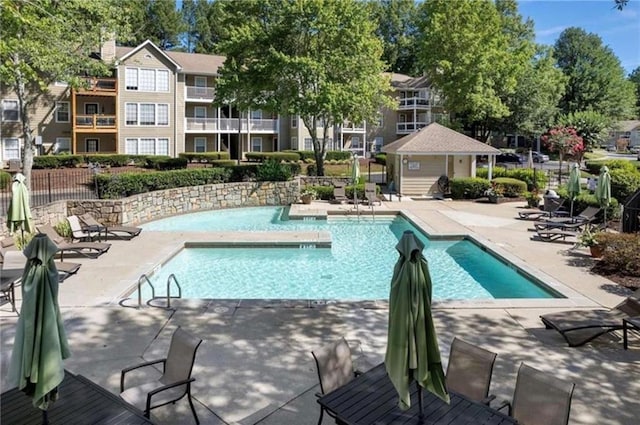 view of pool featuring a patio area