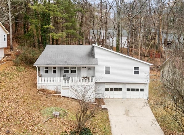 view of front of home featuring covered porch and a garage