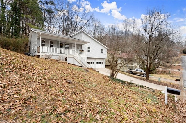 view of front facade with covered porch and a garage