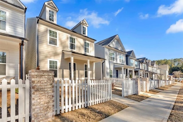 view of front of property featuring a fenced front yard and a residential view