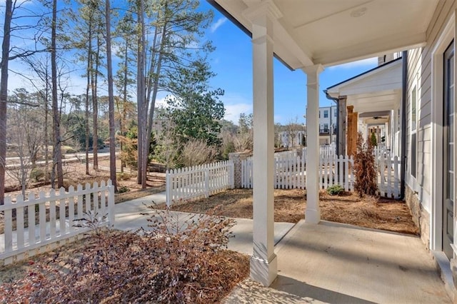 view of patio / terrace featuring fence