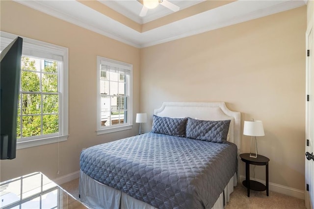 bedroom featuring crown molding, light colored carpet, and ceiling fan