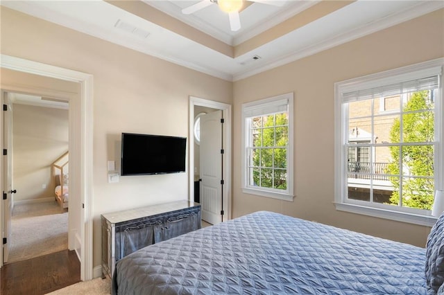 bedroom featuring ornamental molding, carpet, and ceiling fan