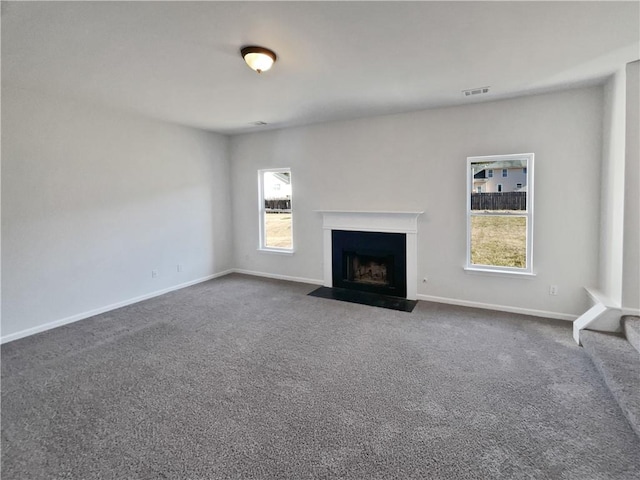 unfurnished living room with carpet flooring