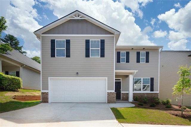 view of front of property with a front lawn and a garage