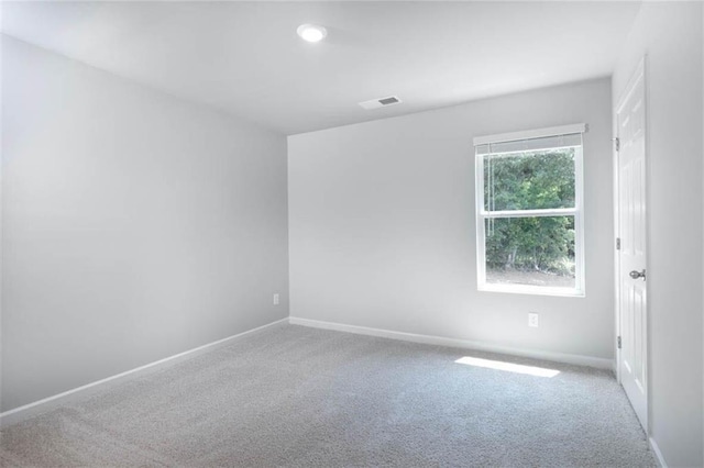 unfurnished room featuring carpet floors