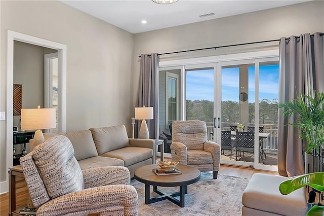 living room with light hardwood / wood-style floors