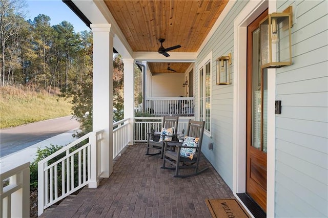 balcony featuring covered porch and a ceiling fan