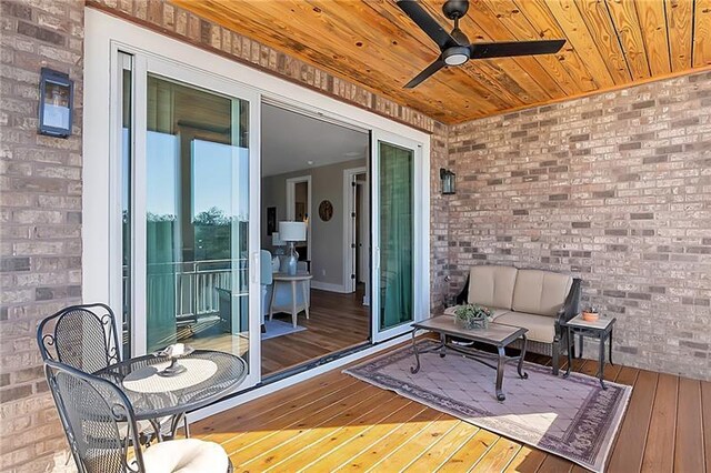 deck featuring outdoor lounge area and ceiling fan