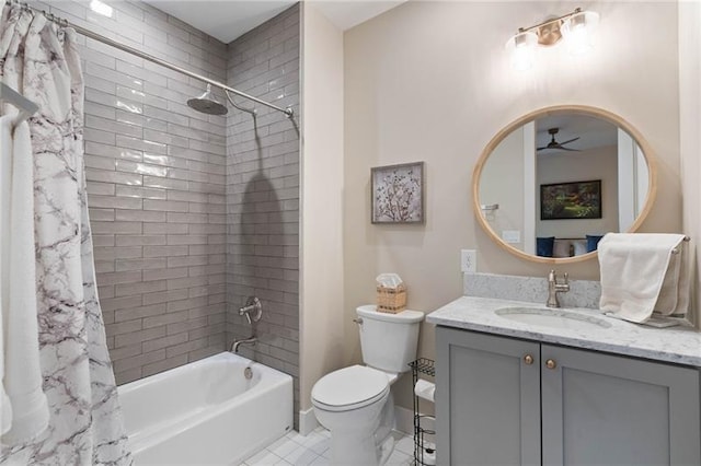 full bathroom with vanity, tile patterned floors, ceiling fan, toilet, and shower / tub combo