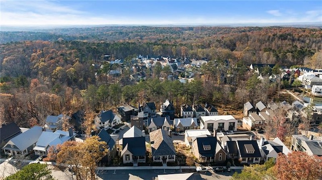 aerial view with a wooded view and a residential view