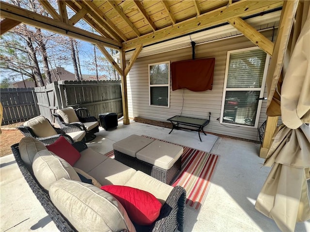view of patio with fence and an outdoor hangout area