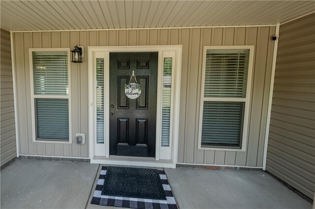 entrance to property featuring board and batten siding