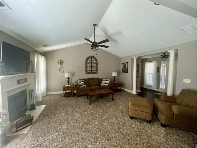 carpeted living room featuring vaulted ceiling, plenty of natural light, a ceiling fan, and decorative columns