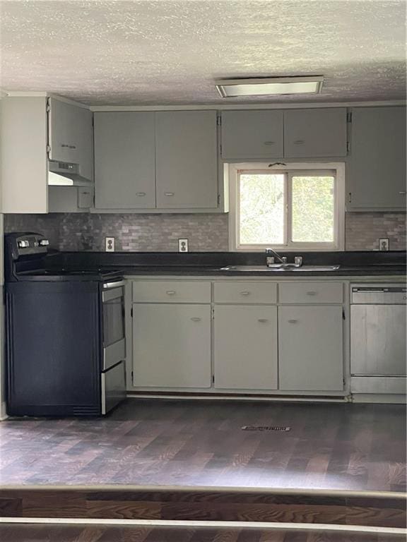 kitchen with dishwashing machine, a textured ceiling, decorative backsplash, and stainless steel electric range