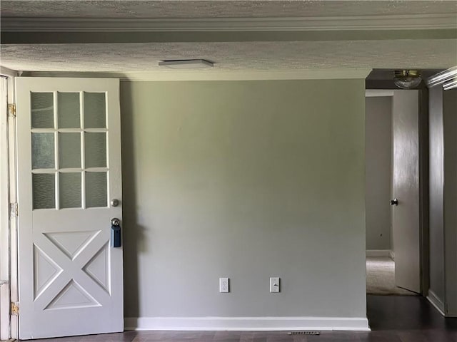 unfurnished room featuring crown molding