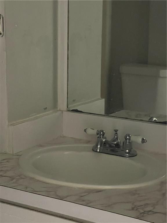 bathroom with toilet and vanity