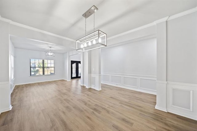 unfurnished dining area featuring hardwood / wood-style flooring and crown molding