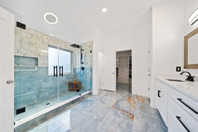 bathroom with vanity and walk in shower