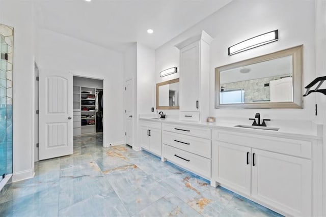 bathroom featuring vanity and an enclosed shower