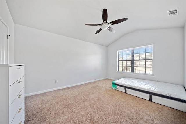 unfurnished bedroom with lofted ceiling, ceiling fan, and light colored carpet