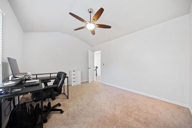 office area featuring light carpet, vaulted ceiling, and ceiling fan