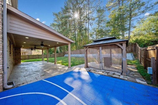 exterior space featuring a gazebo and ceiling fan