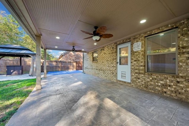 view of patio / terrace featuring ceiling fan and a gazebo