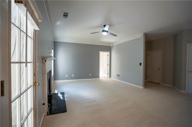 unfurnished living room featuring visible vents, ceiling fan, light colored carpet, and baseboards