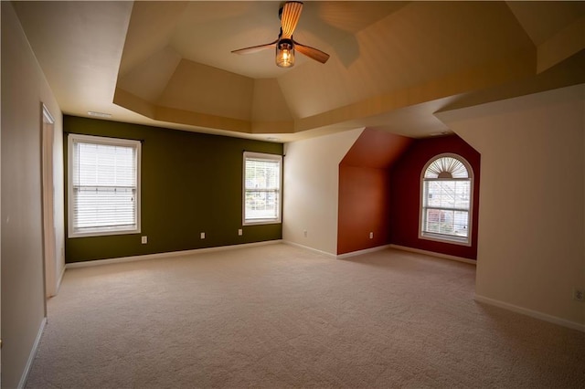 additional living space with ceiling fan, baseboards, carpet, and lofted ceiling