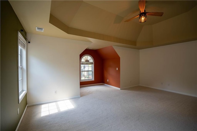bonus room featuring visible vents, baseboards, a ceiling fan, carpet, and vaulted ceiling