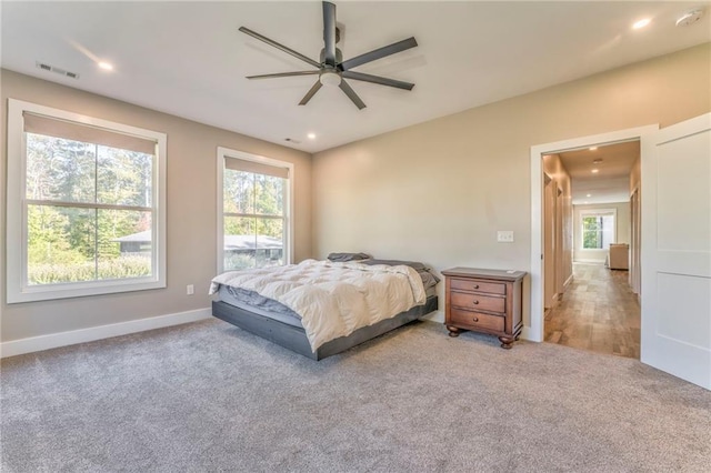 carpeted bedroom featuring ceiling fan