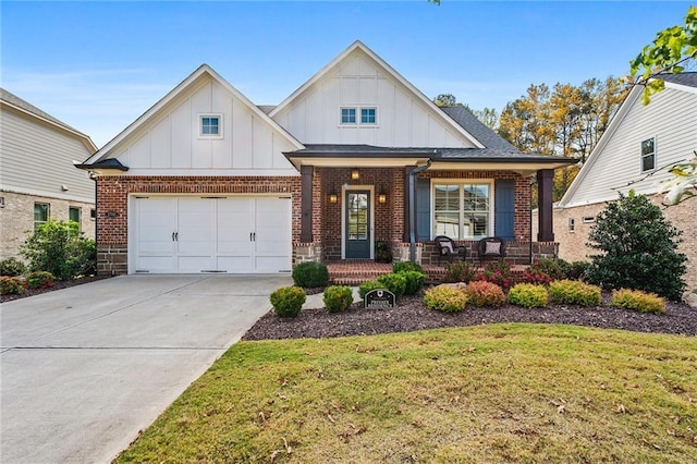 view of front of house featuring a front lawn, a porch, and a garage