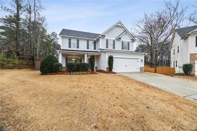 craftsman-style house with a garage, a porch, and a front yard