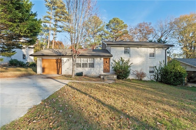 view of front facade with a garage and a front lawn