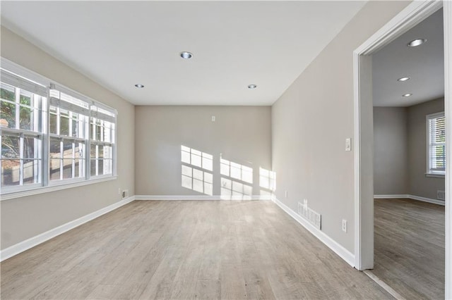 spare room with light hardwood / wood-style floors