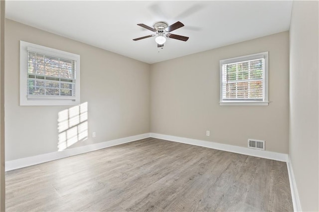 unfurnished room featuring ceiling fan and light hardwood / wood-style floors