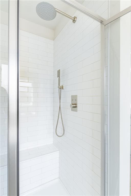 bathroom with a shower stall