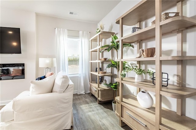 interior space featuring wood finished floors and visible vents