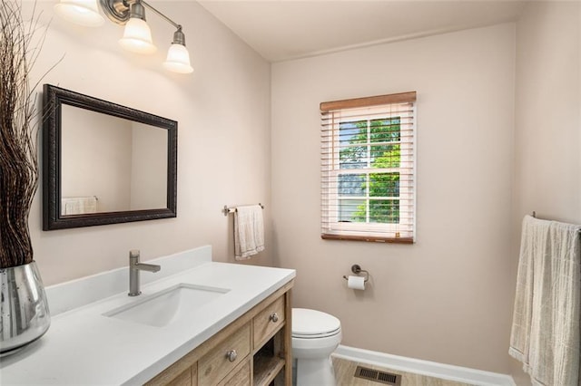 1928 Main St NW, Atlanta, GA 30318 - half bathroom with toilet, vanity, and baseboards
