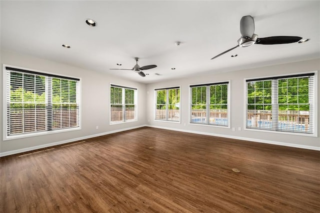 1928 Main St NW, Atlanta, GA 30318 - unfurnished living room featuring ceiling fan, baseboards, dark wood-type flooring, and recessed lighting